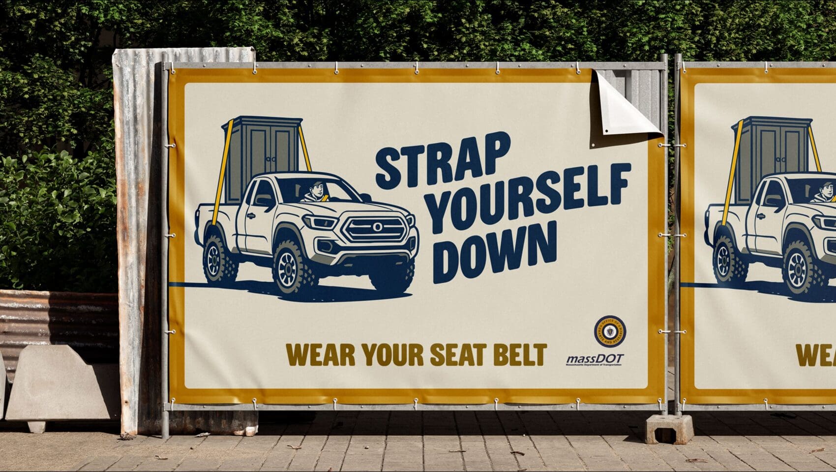 Banner showing a pickup truck with a seatbelt illustration and text: “STRAP YOURSELF DOWN. WEAR YOUR SEAT BELT.” MassDOT logo shown in the bottom right corner.