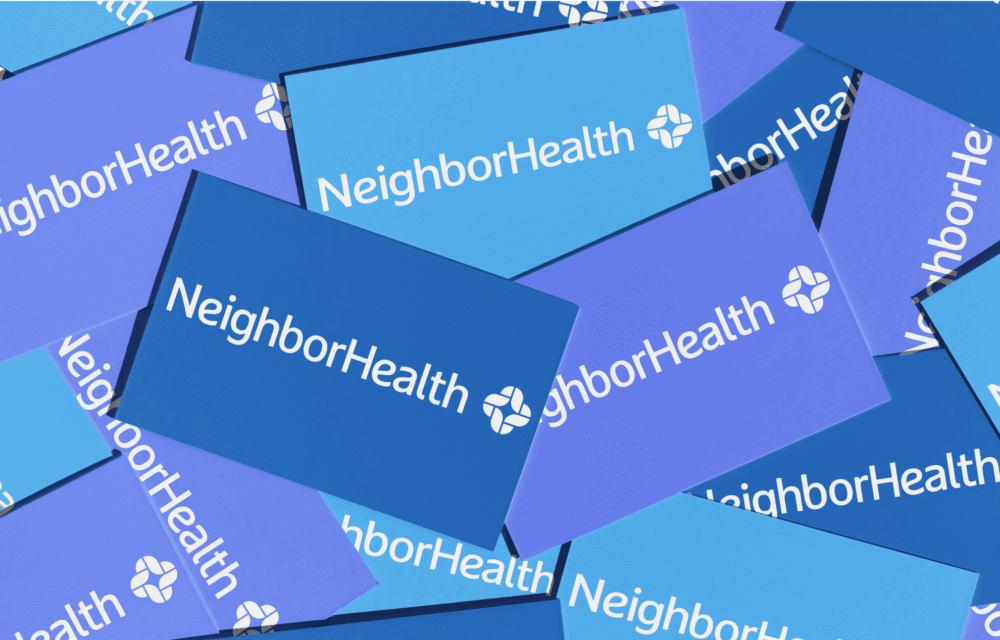 A pile of overlapping business cards displaying the "NeighborHealth" logo in white text on varying shades of blue backgrounds.