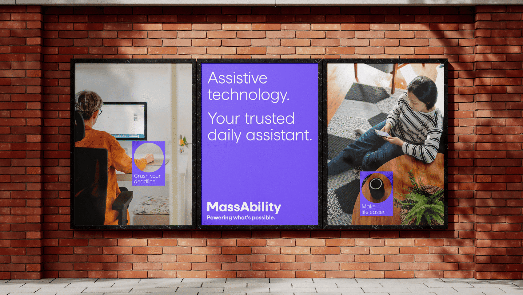 Billboard with two people using technology and text: "Assistive technology. Your trusted daily assistant. MassAbility. Powering what’s possible. Make life easier.
